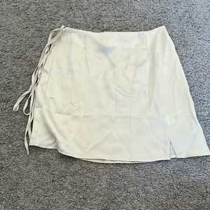 Satin skirt with bow detail and side zip